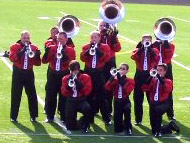 Muchachos horn players performing on the field at Fiesta de Musica III