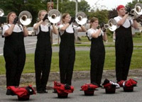 Section of the horn line warming up before the show in Kingston, NY. August 8, 2009